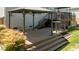 Multi-level backyard deck featuring a gazebo-style shelter and staircase at 9212 Linslade Way, Wake Forest, NC 27587
