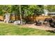 Landscaped backyard with patio and a charming stone fire pit, perfect for outdoor gatherings at 9212 Linslade Way, Wake Forest, NC 27587