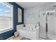 Bathroom featuring a soaking tub and a glass-enclosed shower at 9212 Linslade Way, Wake Forest, NC 27587