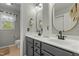 A bathroom with dual sinks and neutral-toned walls and floors at 9212 Linslade Way, Wake Forest, NC 27587
