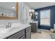 A bathroom featuring dual sinks, modern fixtures, and a well-lit vanity at 9212 Linslade Way, Wake Forest, NC 27587