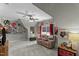 Spacious bonus room with movie decor, comfortable seating, and a ceiling fan at 9212 Linslade Way, Wake Forest, NC 27587