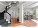 Spacious foyer showcasing hardwood floors, a staircase, and an open entryway to the office at 9212 Linslade Way, Wake Forest, NC 27587