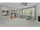 An open living room flows to the kitchen, complete with modern seating and fireplace at 9212 Linslade Way, Wake Forest, NC 27587