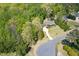Aerial view of the property showing its location among mature trees and lush landscaping at 936 Elbridge Dr, Raleigh, NC 27603