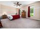 Neutral bedroom with ceiling fan, natural light and hardwood floors at 936 Elbridge Dr, Raleigh, NC 27603