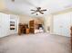 Bedroom featuring tan carpet, a bunk bed, a desk and a double door closet at 936 Elbridge Dr, Raleigh, NC 27603