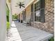 The home has a beautiful front porch with a seating area and ceiling fans, offering a comfortable outdoor space at 936 Elbridge Dr, Raleigh, NC 27603