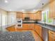 Eat-in kitchen with granite countertops, stainless steel appliances, and ample cabinet space at 936 Elbridge Dr, Raleigh, NC 27603