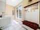 Laundry room area featuring a washer, sink and hall tree with hooks and a bench at 936 Elbridge Dr, Raleigh, NC 27603