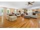Spacious living room with hardwood floors, neutral paint colors and access to kitchen and dining area at 936 Elbridge Dr, Raleigh, NC 27603
