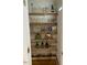 Walk-in pantry with wooden shelves and ample storage space for food and kitchen essentials at 936 Elbridge Dr, Raleigh, NC 27603