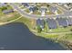 A captivating aerial view showcases homes nestled by a serene lake in a well-planned community at 98 Buddy Campbell Ct, Angier, NC 27501