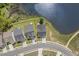 Overhead view of homes nestled next to a picturesque lake, showcasing serene neighborhood at 98 Buddy Campbell Ct, Angier, NC 27501