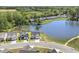 Drone view showcasing the home's location adjacent to a large lake and community at 98 Buddy Campbell Ct, Angier, NC 27501