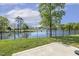View of the lawn with a lake view on a sunny day perfect for outdoor activities at 98 Buddy Campbell Ct, Angier, NC 27501