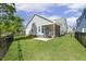 This home features a screened in back porch and fenced backyard on a well-maintained lawn at 98 Buddy Campbell Ct, Angier, NC 27501
