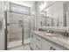 Modern bathroom with double sink vanity, granite countertop and tiled walk-in shower at 98 Buddy Campbell Ct, Angier, NC 27501