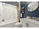 Stylish bathroom with a bathtub, shower combination, and contemporary fixtures at 98 Buddy Campbell Ct, Angier, NC 27501