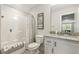 Well-lit bathroom with granite vanity top, white cabinets, and shower with tub combination at 98 Buddy Campbell Ct, Angier, NC 27501