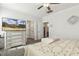 Bright bedroom featuring a TV, ensuite bathroom, and a calming color palette at 98 Buddy Campbell Ct, Angier, NC 27501