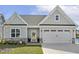 Charming home featuring stone accents, a two-car garage, and a welcoming entrance at 98 Buddy Campbell Ct, Angier, NC 27501