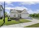 Beautiful single-Gathering home with a well-manicured lawn, attached garage and water view at 98 Buddy Campbell Ct, Angier, NC 27501