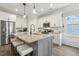 Modern kitchen with granite island, stainless steel appliances, and ample cabinet space at 98 Buddy Campbell Ct, Angier, NC 27501