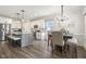 Stylish kitchen flows into a dining area with ample counter space and modern appliances at 98 Buddy Campbell Ct, Angier, NC 27501