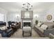 Bright living room boasting fireplace, neutral walls, chandelier and comfortable seating at 98 Buddy Campbell Ct, Angier, NC 27501