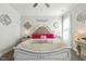 Comfortable main bedroom featuring a decorative headboard, lamps, and soft carpet flooring at 98 Buddy Campbell Ct, Angier, NC 27501
