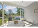 Relaxing screened patio with serene lake views, perfect for outdoor enjoyment and relaxation at 98 Buddy Campbell Ct, Angier, NC 27501