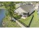 Aerial of back of house featuring a fenced yard, screened porch, and lake views at 98 Buddy Campbell Ct, Angier, NC 27501