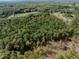 Expansive aerial view of densely wooded land, providing a sense of natural beauty and seclusion at 000 Olivia Pope Way, Efland, NC 27243