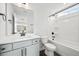 Well-lit bathroom featuring a single sink, toilet, and combination tub and shower at 000 Olivia Pope Way, Efland, NC 27243
