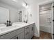 Bright bathroom features a double sink vanity, modern lighting, and a bathtub with a shower at 000 Olivia Pope Way, Efland, NC 27243