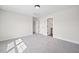 Spacious bedroom boasts neutral carpet, recessed lighting, and dual closets for storage at 000 Olivia Pope Way, Efland, NC 27243