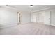 Large bedroom offers plenty of space and natural light with neutral carpet and white trim at 000 Olivia Pope Way, Efland, NC 27243
