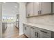 Stylish kitchen showcasing grey cabinets, white countertops, and modern appliances at 000 Olivia Pope Way, Efland, NC 27243