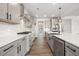 Modern kitchen showcases gray cabinets, stainless steel appliances, subway tile backsplash, and gas cooktop at 000 Olivia Pope Way, Efland, NC 27243