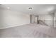 Carpeted upstairs loft with natural light and railing at 000 Olivia Pope Way, Efland, NC 27243