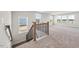Upstairs loft features large windows with scenic outdoor views and soft carpeting at 000 Olivia Pope Way, Efland, NC 27243