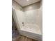 Bright bathroom featuring a tub shower with silver hardware and neutral wall colors at 10 Riverview Rd, Erwin, NC 28339