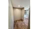 Hallway leading to a butler's pantry with white cabinetry and modern finishes at 10 Riverview Rd, Erwin, NC 28339