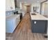 Bright and airy kitchen with a center island, stainless steel appliances, and sleek cabinetry at 10 Riverview Rd, Erwin, NC 28339
