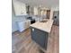 Open kitchen featuring an island with seating, stainless steel appliances, and stylish countertops at 10 Riverview Rd, Erwin, NC 28339