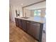 Well-appointed kitchen with a large island, stainless steel dishwasher, and modern finishes at 10 Riverview Rd, Erwin, NC 28339