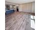 Open-concept living area with modern finishes, including a kitchen island and stylish flooring at 10 Riverview Rd, Erwin, NC 28339