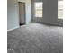 Bedroom features plush carpet and two large windows that provide abundant natural light at 100 Landon Pl, Roxboro, NC 27573