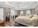 Spacious bedroom featuring hardwood-style flooring, natural light, and ample space for relaxation at 101 Rustic Pine Ct, Apex, NC 27502